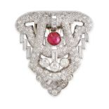 AN ART DECO DIAMOND AND RUBY CLIP BROOCH in platinum, designed as a shield, set with a cabochon ruby
