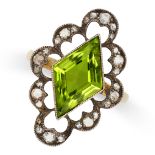 A PERIDOT AND DIAMOND RING set with lozenge shaped peridot in a scalloped openwork border set with