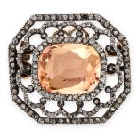 AN ANTIQUE TOPAZ AND DIAMOND BROOCH in yellow gold and silver, set with a cushion cut peach topaz of