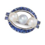 A VINTAGE SAPPHIRE AND PEARL RING set with three graduated pearls within a stylised border of step