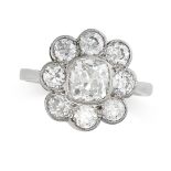 A DIAMOND CLUSTER RING in platinum, set with an old cut diamond of approximately 1.25 carats in a
