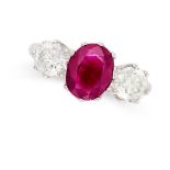 A BURMESE RUBY AND DIAMOND THREE STONE RING in platinum, set with an oval cut ruby of 2.06 carats