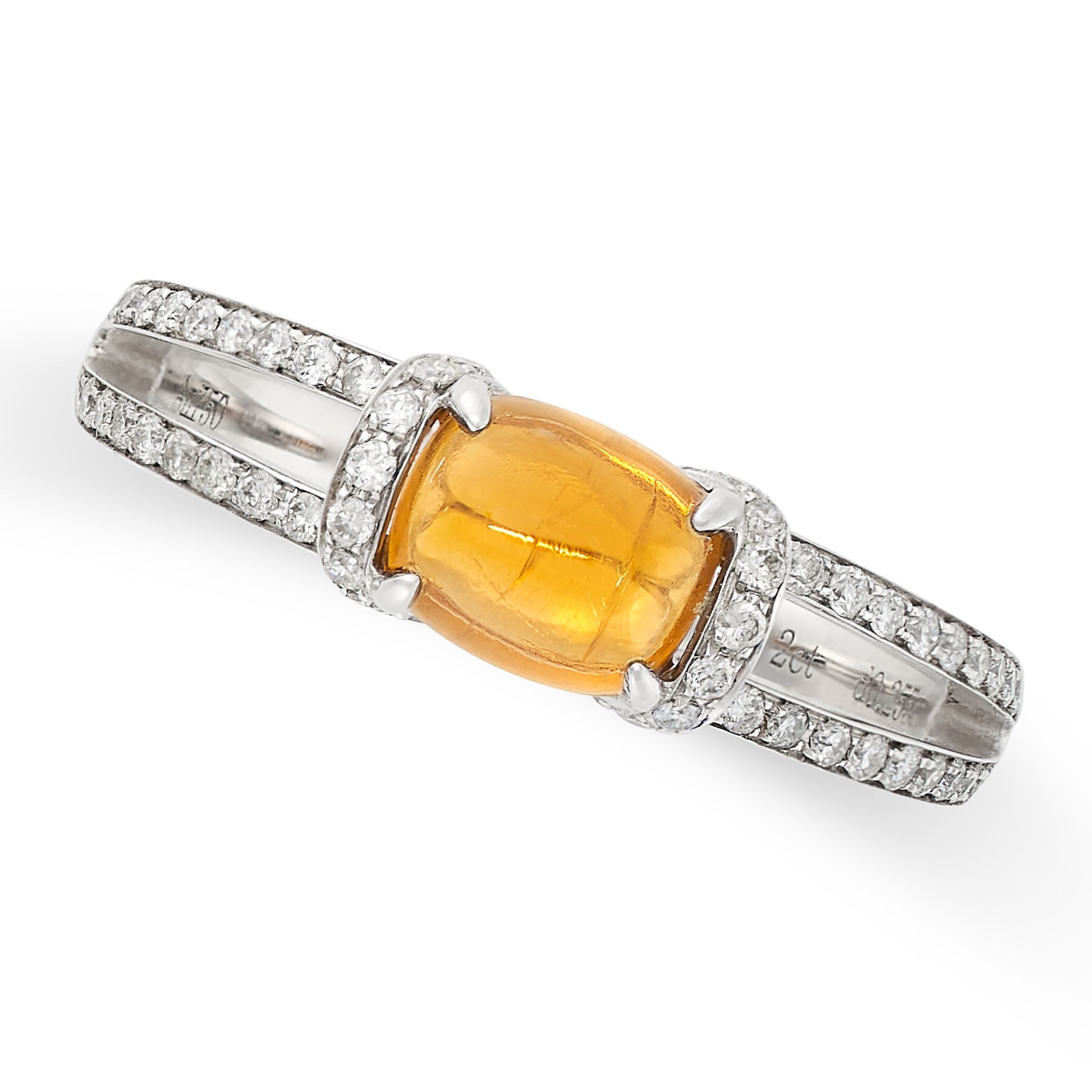 A YELLOW GARNET AND DIAMOND RING in 18ct white gold, set with a cabochon yellow garnet of 0.92