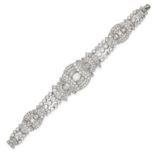 A VINTAGE DIAMOND BRACELET in 18ct white gold, set with old cut and baguette cut diamonds in a