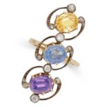 A MULTICOLOURED SAPPHIRE AND DIAMOND RING in yellow gold and silver, set with an oval cut purple,