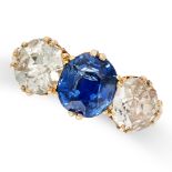 A THREE STONE SAPPHIRE AND DIAMOND RING in 18ct yellow gold, set with an oval cut sapphire of