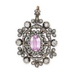 AN ANTIQUE PINK TOPAZ AND DIAMOND PENDANT in yellow gold and silver, set with an oval cut pink topaz