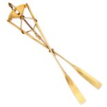 A VINTAGE CROSSED OARS BROOCH in 15ct yellow gold, designed as a pair of crossed oars tied by a wire