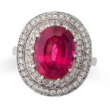 A RUBELLITE TOURMALINE AND DIAMOND RING set with an oval cut rubellite tourmaline of approximately