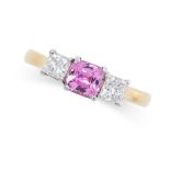 A PINK SAPPHIRE AND DIAMOND RING in 18ct yellow gold, set with a cushion cut pink sapphire between