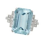 AN AQUAMARINE AND DIAMOND RING in platinum, set with an octagonal cut aquamarine of approximately