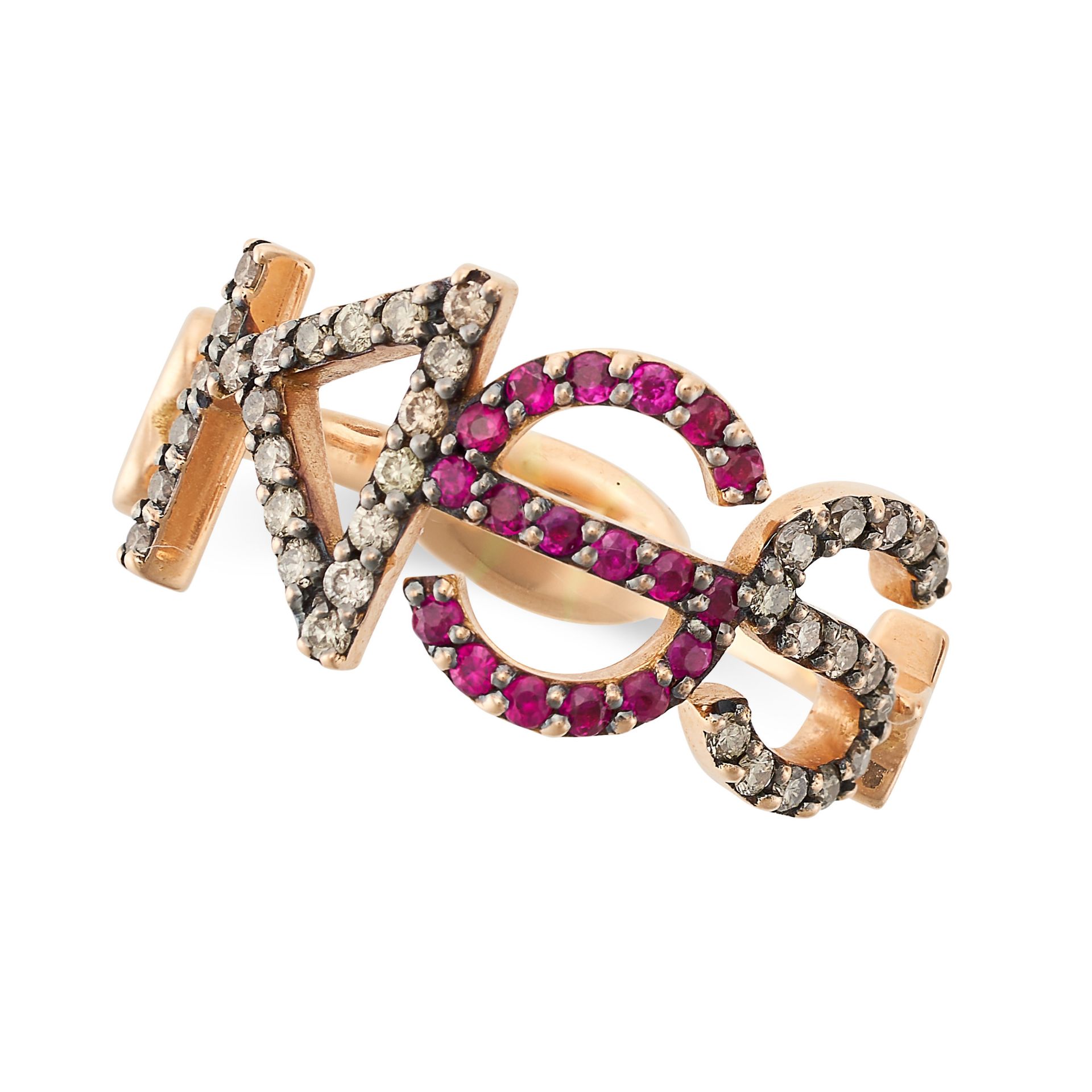 A DIAMOND AND RUBY RING in 18ct yellow gold, stylised as the word KISS set with round brilliant
