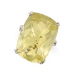 A LEMON QUARTZ COCKTAIL RING in 18ct white gold, set with a faceted cushion shaped lemon quartz,