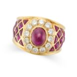 A RUBY AND DIAMOND DRESS RING in 18ct yellow gold, set with a cabochon ruby in a cluster of round