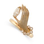 A GEMSET HAND RING in 18ct yellow gold, stylised as a hand holding a marquise cut colourless