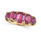 A GARNET FIVE STONE RING in yellow gold, set with a row of five graduated cushion cut garnets, no