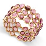 A PINK TOURMALINE FULL ETERNITY RING in 18ct yellow gold, set all around with three rows of cabochon