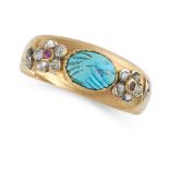 AN ANTIQUE TURQUOISE, DIAMOND AND RUBY RING in yellow gold, set with an oval carved turquoise, the