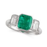 A FINE COLOMBIAN EMERALD AND DIAMOND THREE STONE RING set with an octagonal step cut emerald of 2.04