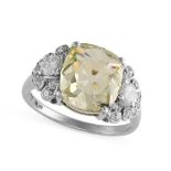 A FANCY GREENISH YELLOW DIAMOND RING in platinum, set with a cushion cut fancy greenish yellow