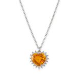 A CEYLON YELLOW SAPPHIRE AND DIAMOND HEART PENDANT NECKLACE in 18ct white gold, the pendant set with