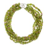 A PERIDOT AND PINK SAPPHIRE NECKLACE comprising seven rows of tumbled peridot beads and faceted pink