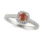 A FANCY DEEP BROWNISH ORANGE DIAMOND RING in platinum, set with a fancy deep brownish orange round