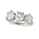 A DIAMOND THREE STONE RING in white gold, set with three round brilliant cut diamonds, the