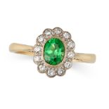A DEMANTOID GARNET AND DIAMOND CLUSTER RING in 18ct yellow and white gold, set with an oval cut