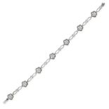 A DIAMOND BRACELET in 18ct white gold, the bracelet comprising seven floral cluster links set with