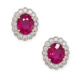 A PAIR OF RUBY AND DIAMOND CLUSTER STUD EARRINGS in 18ct white gold, each set with an oval cut