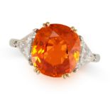 AN ORANGE SAPPHIRE AND DIAMOND RING in 18ct white and yellow gold, set with a cushion cut orange