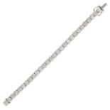 AN IMPORTANT DIAMOND LINE BRACELET in 18ct white gold, set with twenty eight round brilliant cut