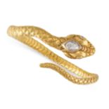 A DIAMOND SNAKE BANGLE in yellow gold, designed as a snake coiled around itself, the head set with a