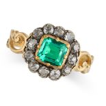 AN ANTIQUE EMERALD AND DIAMOND CLUSTER RING in yellow gold, the centre set with an octagonal cut