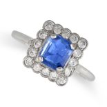 A SAPPHIRE AND DIAMOND CLUSTER RING set with an octagonal step cut sapphire of approximately 1.00