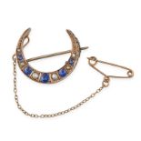 AN ANTIQUE BLUE PASTE AND PEARL CRESCENT BROOCH in 9ct yellow gold, designed as a crescent moon, set