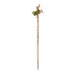 A VINTAGE DEMANTOID GARNET FROG TIE / STICK PIN in yellow gold, the head designed as the body of a