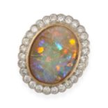 AN OPAL AND DIAMOND CLUSTER RING in yellow gold and platinum, set with a cabochon opal in a