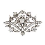 A VINTAGE DIAMOND BROOCH in 18ct white gold, the scrolling body set with old cut diamonds all