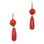 A PAIR OF VINTAGE CORAL DROP EARRINGS in yellow gold, each set with a cabochon coral bead suspending