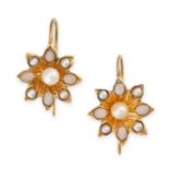 A PAIR OF ANTIQUE PEARL AND CORAL FLOWER EARRINGS in yellow gold, each designed as the head of a
