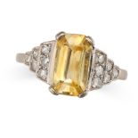 A YELLOW SAPPHIRE AND DIAMOND RING set with an octagonal step cut yellow sapphire of approximately