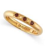 A VINTAGE GARNET THREE STONE BAND RING in 22ct yellow gold, set with three round cut garnets, full