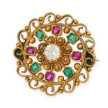 AN ANTIQUE DIAMOND, RUBY AND EMERALD BROOCH in yellow gold, the circular cannetille body set to