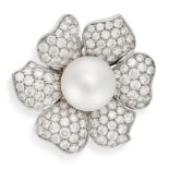 A PEARL AND DIAMOND FLOWER RING in 18ct white gold, set with a pearl of 12.1mm, the petals pave