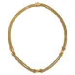 MAPPIN & WEBB, A GOLD NECKLACE in 18ct yellow gold, designed as two rows of woven gold set with