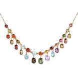 AN ANTIQUE GEMSET HARLEQUIN FRINGE NECKLACE in yellow gold, the fancy link chain and fringe set with