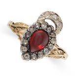 A GARNET AND DIAMOND SWEETHEART RING in yellow gold, set with a pear shaped cabochon cut garnet to a
