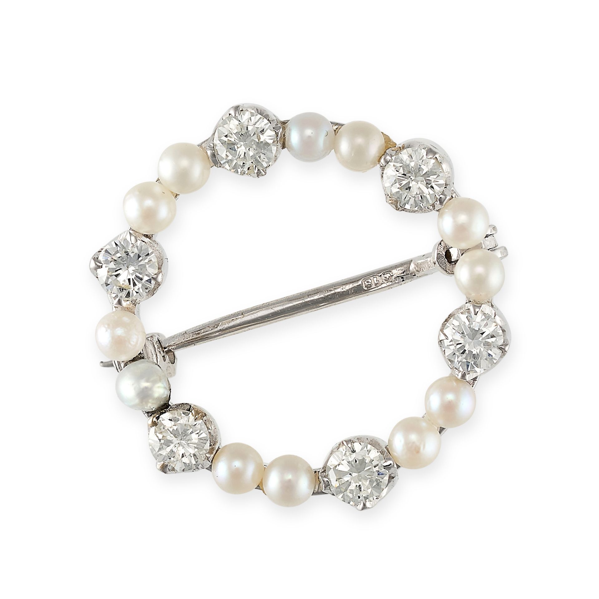 A DIAMOND AND PEARL BROOCH designed as an openwork circle set with alternating pairs of pearls an...